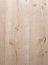 Light wood cabinet door with natural grain and knot details, part of the Deluxe Series.