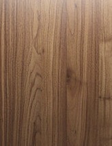 Modern cabinet door with vertical wood grain finish from the Deluxe Series collection.